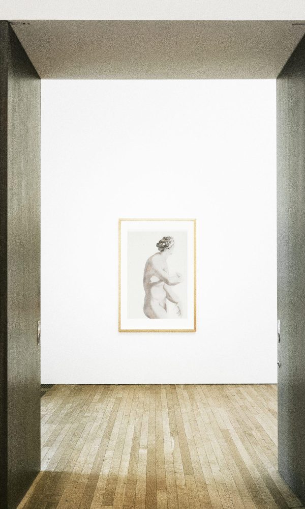 Hallway doors opening to framed art on a wall