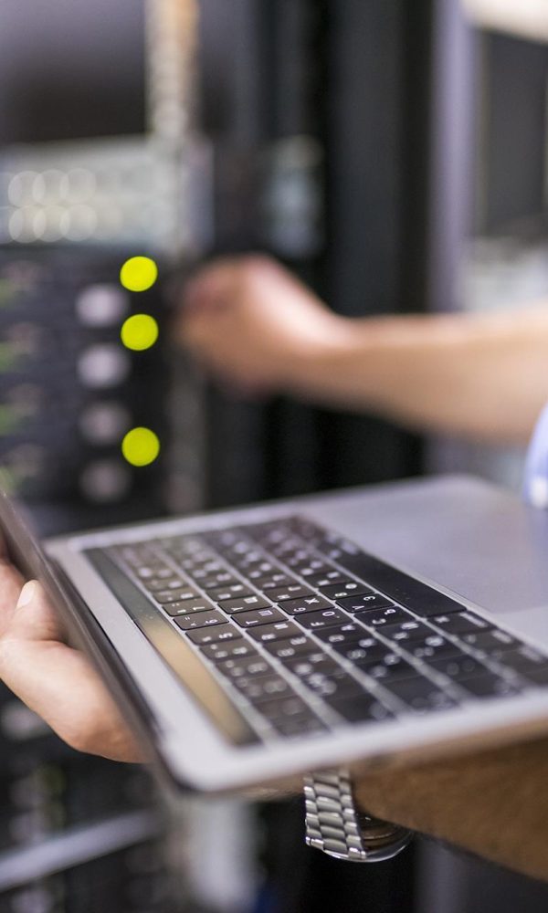 Engineer in the server room close-up. Photo taken at a Data Center in Bulgaria, Eastern Europe.
